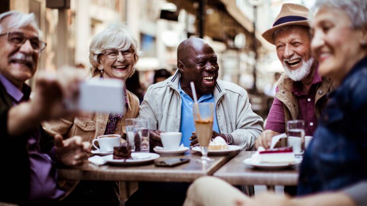 Seniors meeting for coffee outside