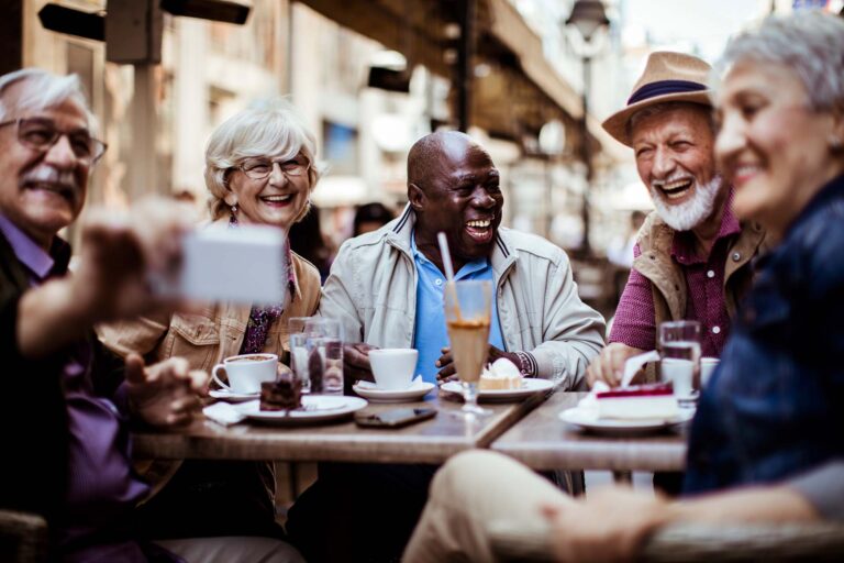 Seniors meeting for coffee outside