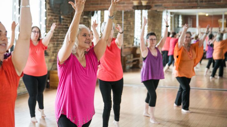 women stretching at fitness class