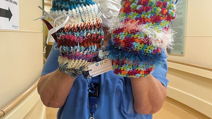 Emergency nurse at Sunnybrook holding twiddlemuffs