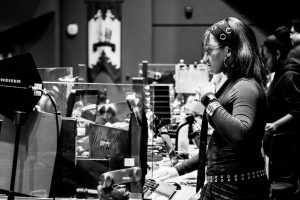 Black and white image of a woman with her music equipment